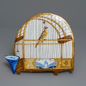 Een polychrome Delftse trompe l'oeil plaquette met een vogelkooi, 18e eeuw